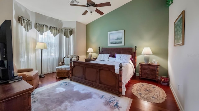 bedroom with ceiling fan, hardwood / wood-style floors, and vaulted ceiling