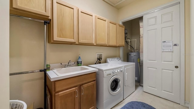 laundry area with sink, cabinets, electric water heater, independent washer and dryer, and light tile patterned floors