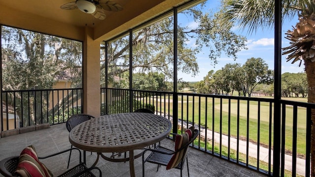 sunroom featuring plenty of natural light and ceiling fan