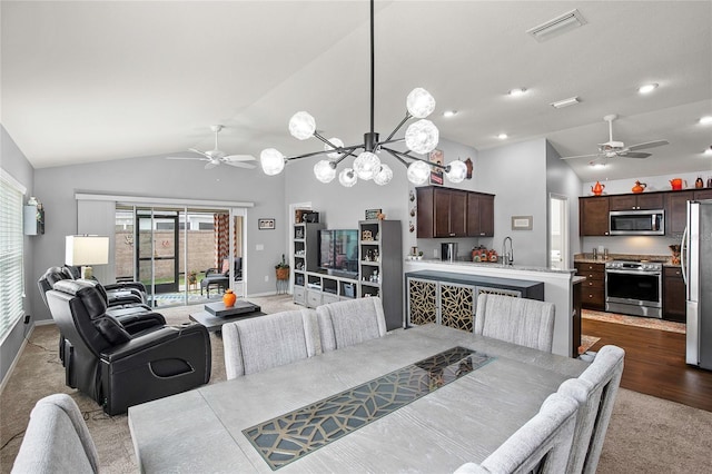 dining space featuring light carpet and lofted ceiling