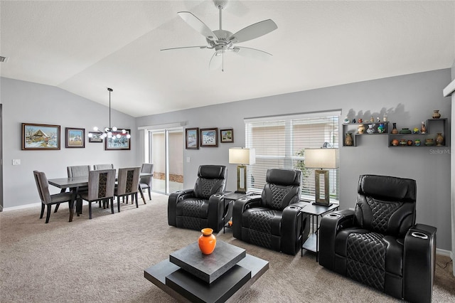 living room featuring ceiling fan with notable chandelier, light colored carpet, and vaulted ceiling