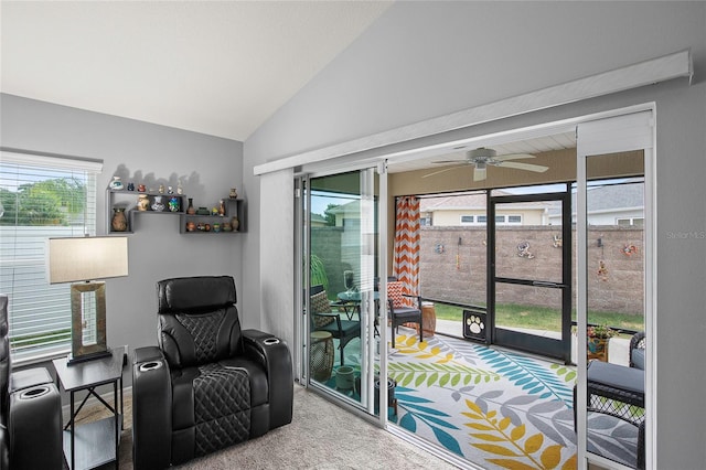 sitting room featuring carpet flooring, vaulted ceiling, and ceiling fan