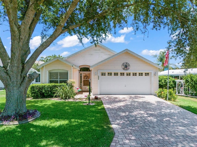 1405 W Schwartz Blvd, The Villages, FL 32159 - ranch-style house featuring a garage, a front lawn, and decorative driveway