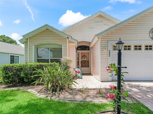 1405 W Schwartz Blvd, The Villages, FL 32159 - view of front facade with an attached garage