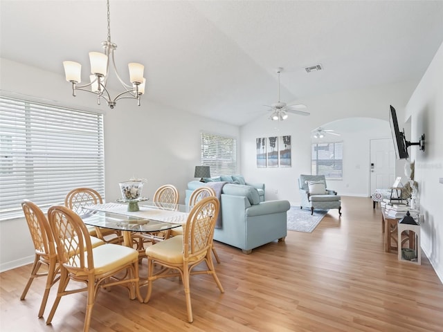 1405 W Schwartz Blvd, The Villages, FL 32159 - dining space with healthy amount of natural light, a ceiling fan, arched walkways, light wood-style floors, and lofted ceiling