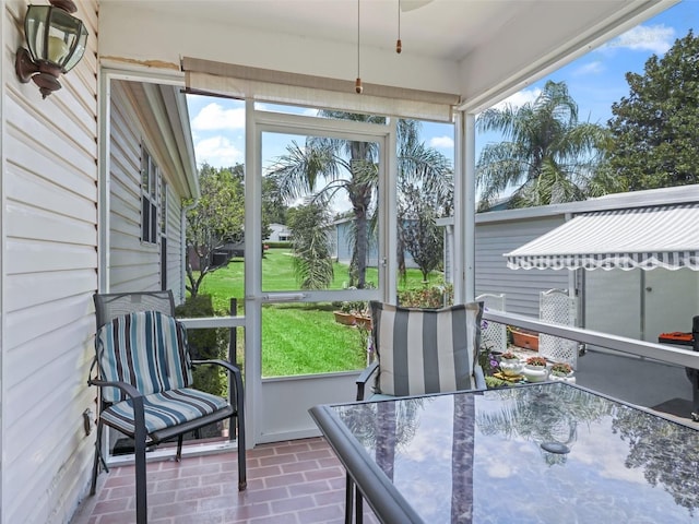 1405 W Schwartz Blvd, The Villages, FL 32159 - sunroom featuring outdoor dining space and a ceiling fan