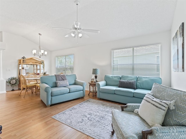 1405 W Schwartz Blvd, The Villages, FL 32159 - living room featuring light wood-style floors, a chandelier, a textured ceiling, ceiling fan, and lofted ceiling