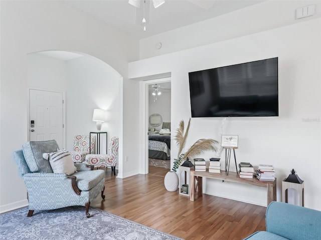 1405 W Schwartz Blvd, The Villages, FL 32159 - living room featuring ceiling fan, wood finished floors, and arched walkways