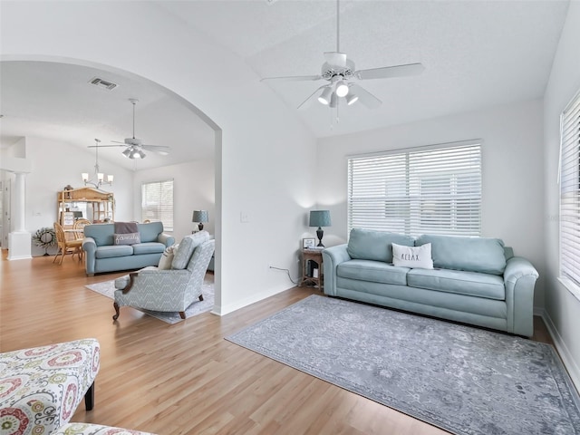 1405 W Schwartz Blvd, The Villages, FL 32159 - living room featuring ceiling fan, lofted ceiling, arched walkways, and wood finished floors