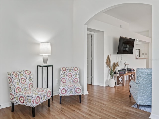 1405 W Schwartz Blvd, The Villages, FL 32159 - living area featuring arched walkways and wood finished floors