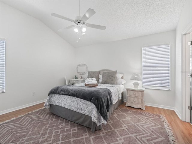 1405 W Schwartz Blvd, The Villages, FL 32159 - bedroom with wood finished floors, lofted ceiling, and a ceiling fan