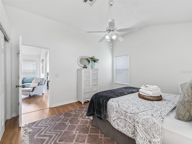 1405 W Schwartz Blvd, The Villages, FL 32159 - bedroom featuring wood finished floors, a closet, lofted ceiling, and ceiling fan