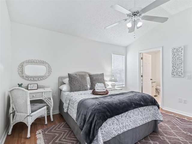 1405 W Schwartz Blvd, The Villages, FL 32159 - bedroom featuring wood finished floors, a textured ceiling, lofted ceiling, ensuite bathroom, and ceiling fan