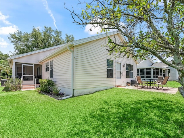 1405 W Schwartz Blvd, The Villages, FL 32159 - back of property with a sunroom, a patio area, and a lawn
