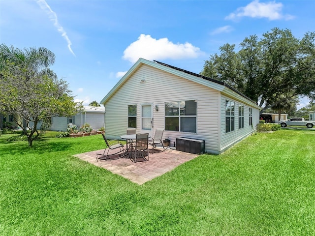 1405 W Schwartz Blvd, The Villages, FL 32159 - back of property with a patio and a lawn