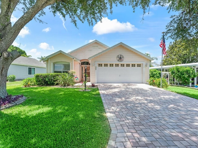 1405 W Schwartz Blvd, The Villages, FL 32159 - ranch-style house with decorative driveway, a garage, and a front lawn