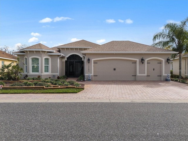 mediterranean / spanish-style home featuring a garage