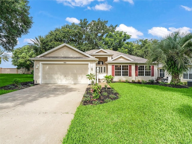 ranch-style home with a front yard and a garage