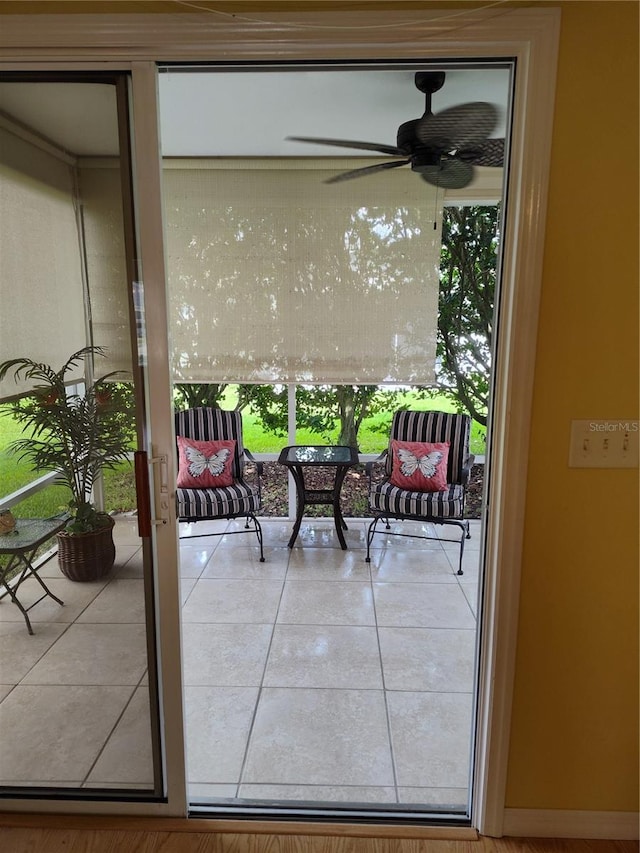 balcony with ceiling fan and a patio