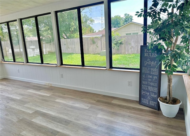 unfurnished sunroom with plenty of natural light