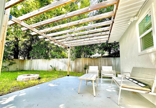 view of patio featuring an outdoor fire pit and a pergola