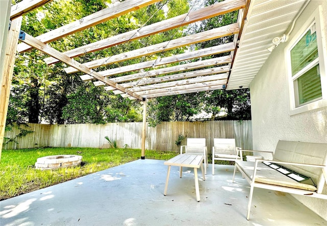view of patio with a fenced backyard, a fire pit, and a pergola