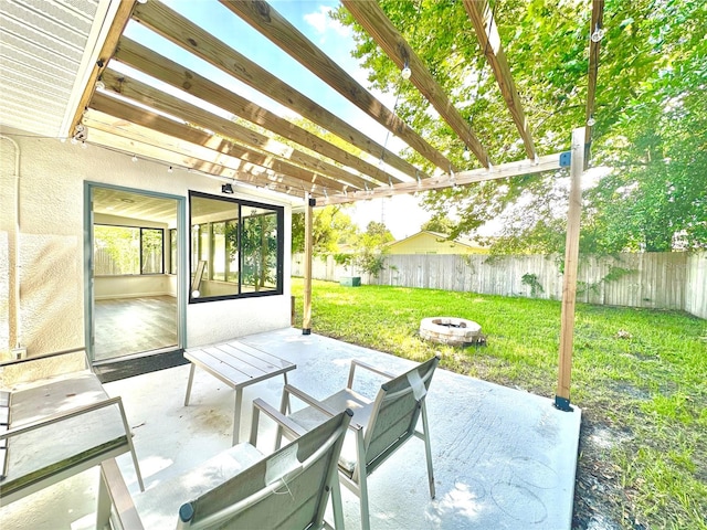 view of patio with a pergola and a fire pit