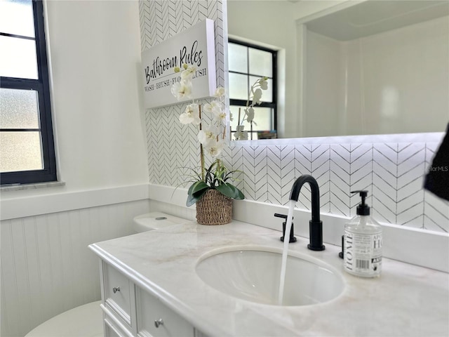 bathroom with vanity and toilet