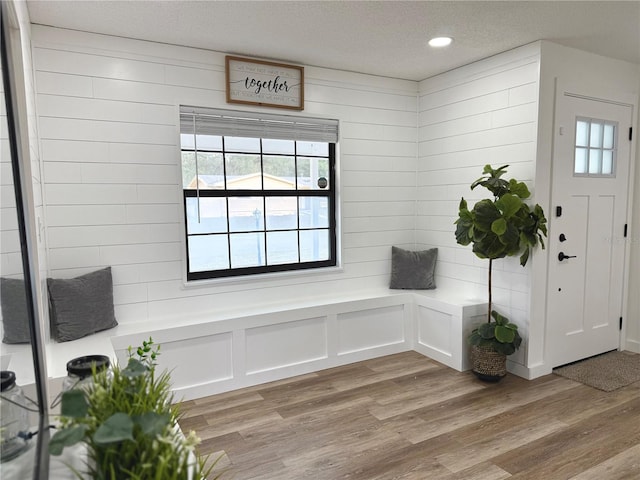 mudroom featuring recessed lighting, a textured ceiling, and light wood finished floors