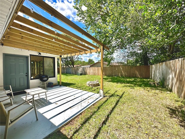 view of yard featuring a fenced backyard, a patio, and a pergola