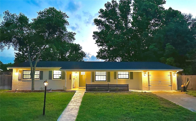 single story home featuring a front lawn and brick siding