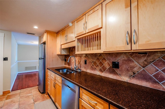 601 W Old Highway 441 Unit 11B, Mount Dora, FL 32757 - kitchen with a sink, stainless steel appliances, backsplash, baseboards, and dark stone countertops