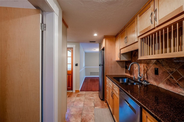 601 W Old Highway 441 Unit 11B, Mount Dora, FL 32757 - kitchen featuring dishwasher, a sink, backsplash, dark stone counters, and freestanding refrigerator
