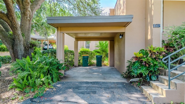 601 W Old Highway 441 Unit 11B, Mount Dora, FL 32757 - view of vehicle parking featuring driveway and a carport