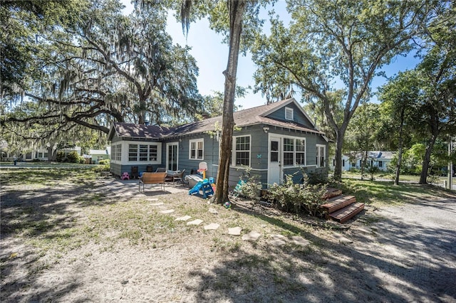 back of house with a patio