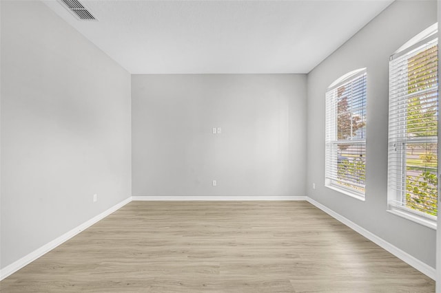 empty room with light hardwood / wood-style floors