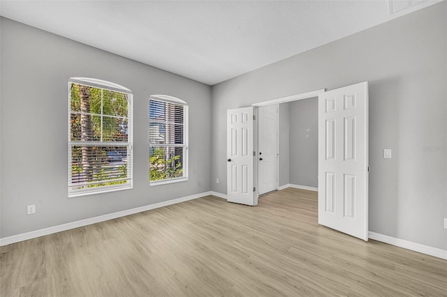 unfurnished bedroom with light hardwood / wood-style floors