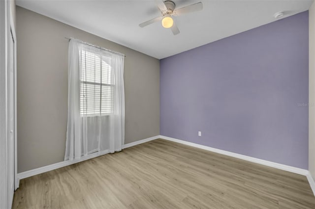 unfurnished room with light hardwood / wood-style flooring and ceiling fan