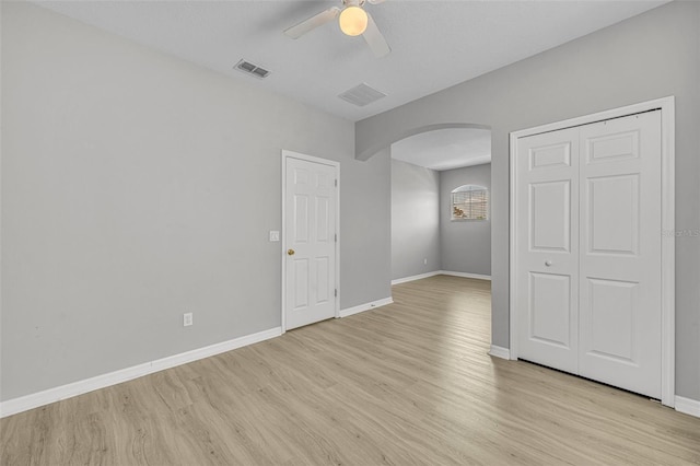 spare room featuring ceiling fan and light hardwood / wood-style flooring