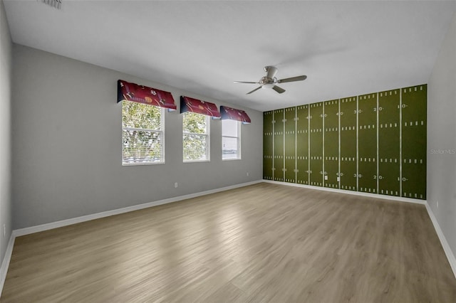 unfurnished room featuring ceiling fan and wood-type flooring