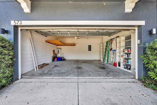 garage with electric panel, water heater, and a garage door opener