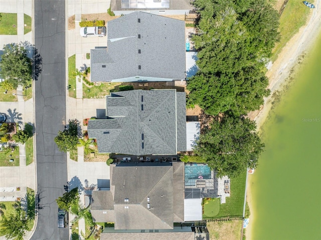 birds eye view of property with a water view