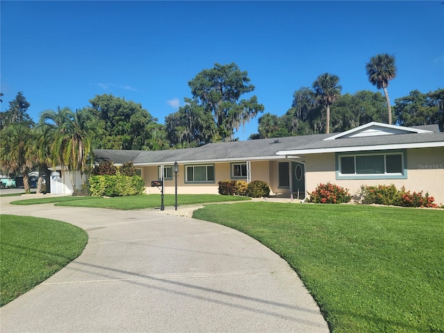 ranch-style home with a front yard