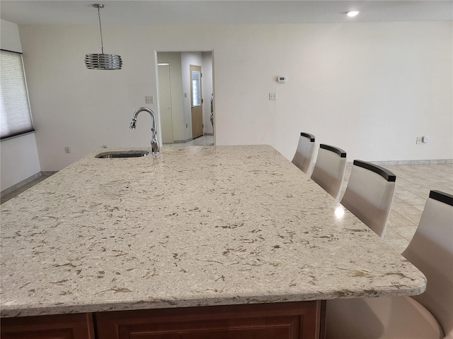 kitchen with decorative light fixtures and sink