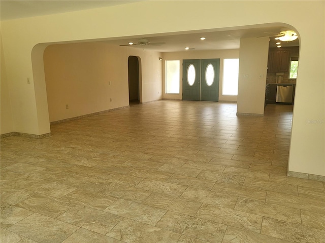 entrance foyer with ceiling fan