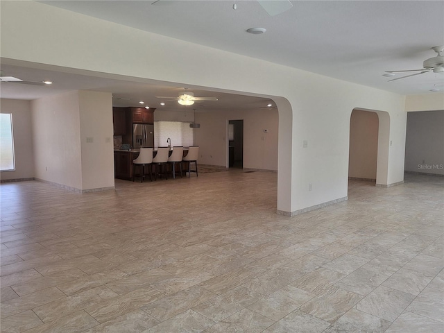 unfurnished room with ceiling fan