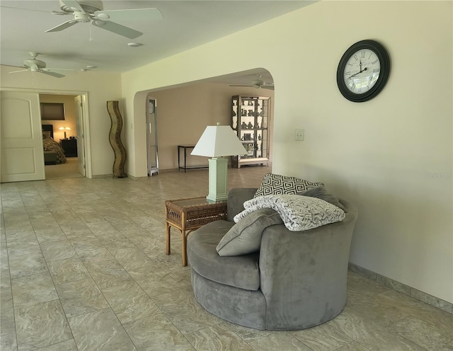 sitting room featuring ceiling fan