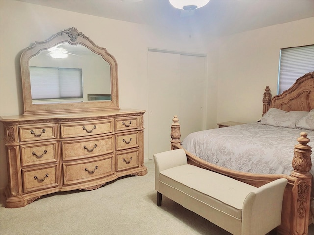 bedroom featuring light carpet