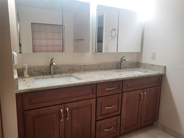 bathroom with vanity and tile patterned flooring