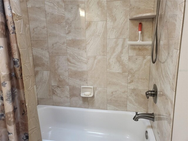 bathroom with shower / tub combo with curtain